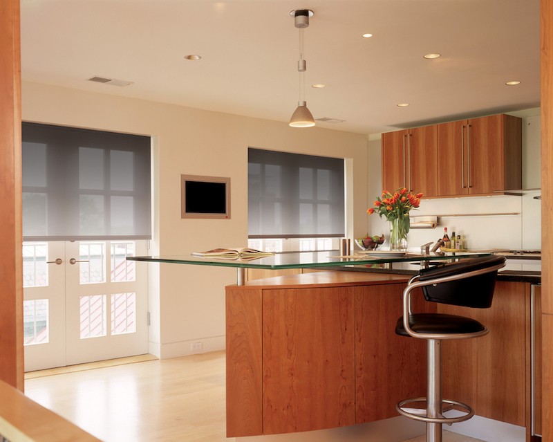 A kitchen with Lutron shading on the windows. 