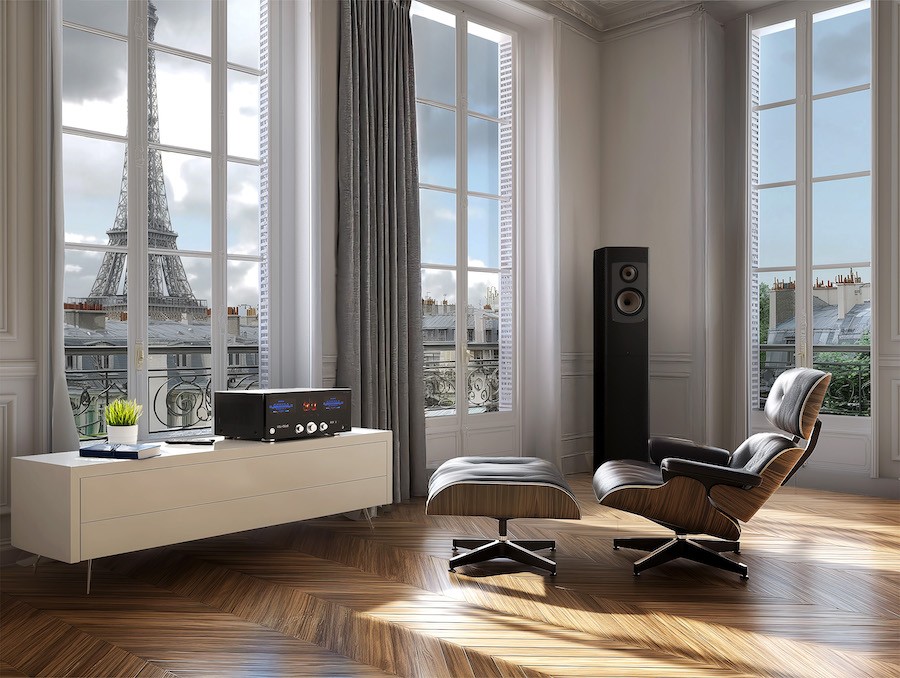The Advance Paris A12 amplifier on a low table in an apartment overlooking the Eiffel Tower.