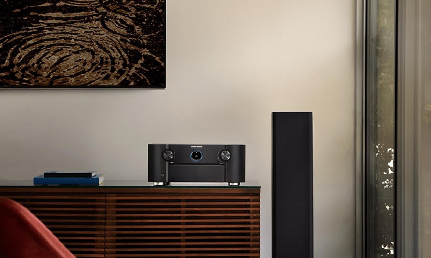 Marantz AV7706 product on a dresser in front of wooden wall